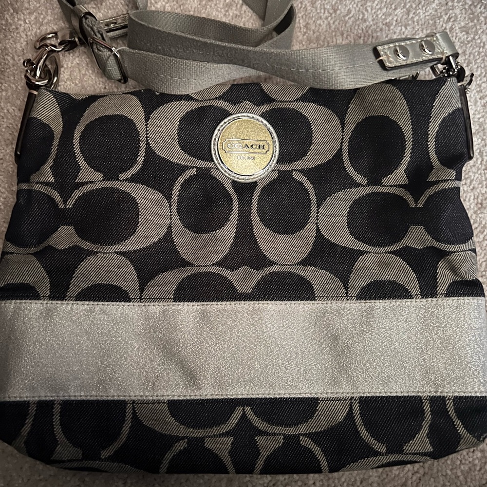 Denim and silver Coach crossbody bag with adjustable strap